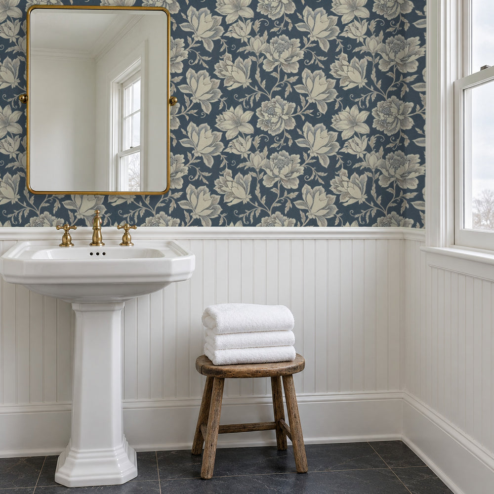 Hattie Denim peel and stick wallpaper above white beadboard in a bathroom with a pedestal sink