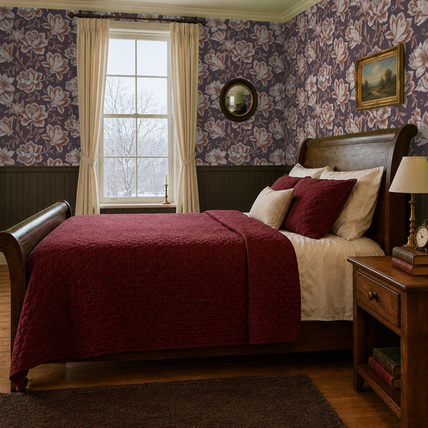 Hattie Terracotta wallpaper on two walls of a vintage bedroom with a sleigh bed