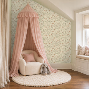 Meadow Clay peel and stick wallpaper in a girl's reading nook with a pink canopy and a window seat