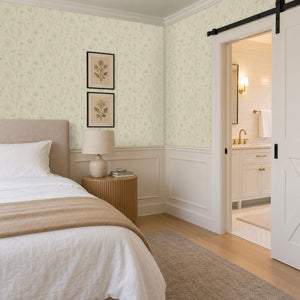 Meadow Linen peel and stick wallpaper in a bedroom beside a sliding barn door