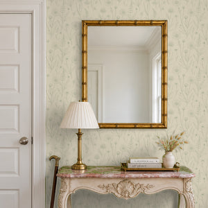 Meadow Linen peel and stick wallpaper in an entry with a gilt bamboo mirror and a console table