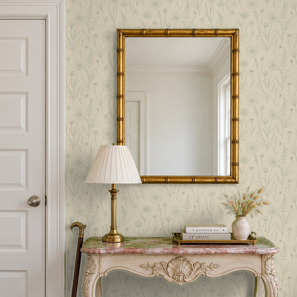 Meadow Linen peel and stick wallpaper in an entry with a gilt bamboo mirror and a console table