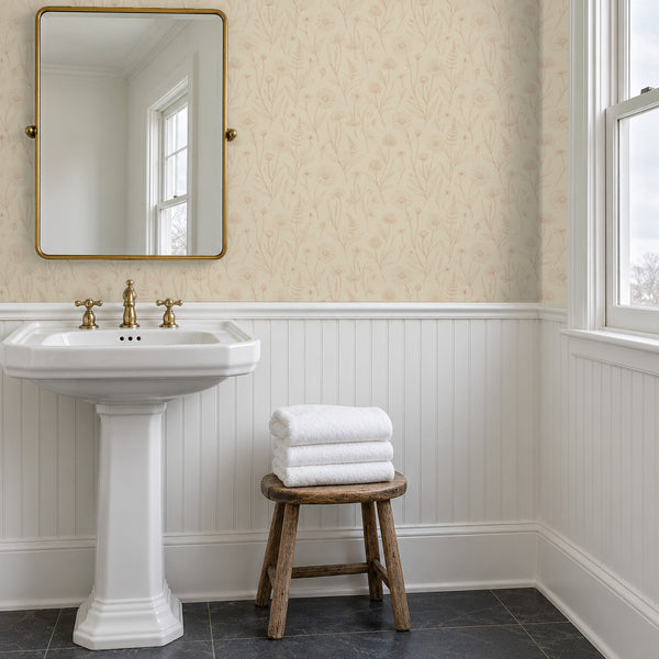 Meadow Sand peel and stick wallpaper above beadboard in a bathroom with a pedestal sink