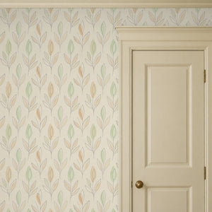 Ottilie Floral peel and stick wallpaper beside a cream paneled door