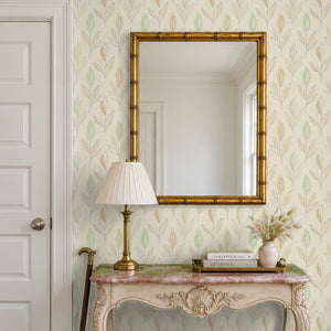 Ottilie Floral peel and stick wallpaper in an entry with a gilt bamboo mirror and a console table