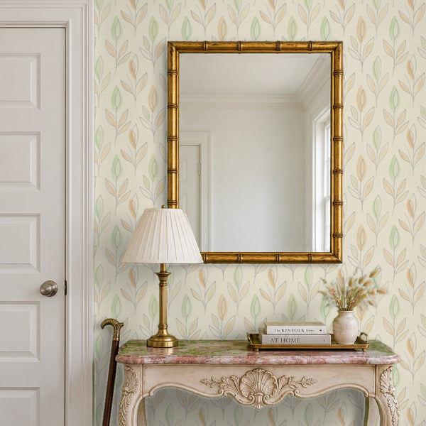 Ottilie Floral peel and stick wallpaper in an entry with a gilt bamboo mirror and a console table