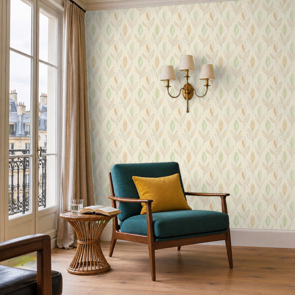 Ottilie Floral peel and stick wallpaper in a reading corner with a green armchair and a wall sconce