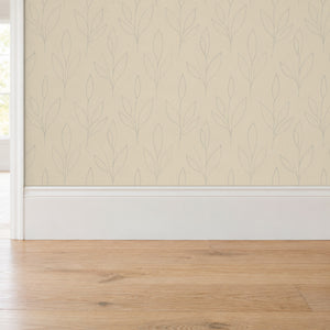 Ottilie Oat peel and stick wallpaper above a white baseboard and oak floor