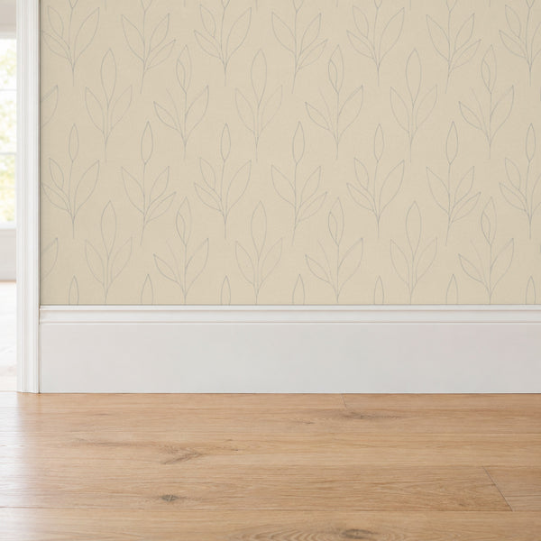 Ottilie Oat peel and stick wallpaper above a white baseboard and oak floor