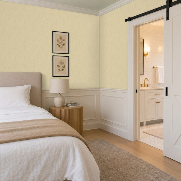 Ottilie Butter peel and stick wallpaper in a bedroom beside a sliding barn door
