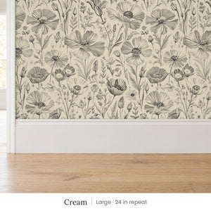 Posy Cream peel and stick wallpaper, large 24 in repeat, above a white baseboard and oak floor