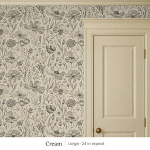 Posy Cream peel and stick wallpaper, large 24 in repeat, beside a cream paneled door