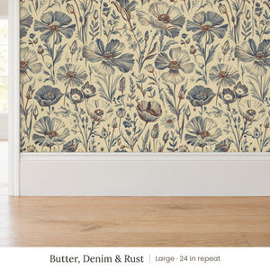 Posy Butter, Denim & Rust peel and stick wallpaper, large 24 in repeat, above a white baseboard and oak floor