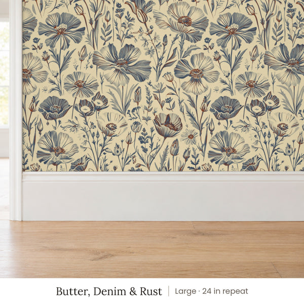 Posy Butter, Denim & Rust peel and stick wallpaper, large 24 in repeat, above a white baseboard and oak floor