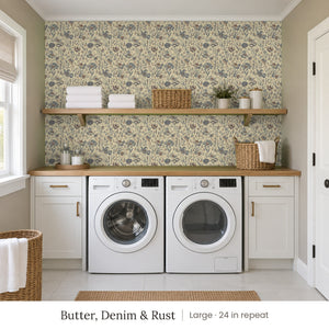 Posy Butter, Denim & Rust peel and stick wallpaper, large 24 in repeat, in a laundry room with a wood shelf above the machines