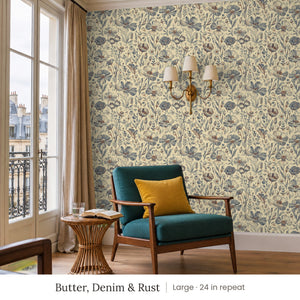 Posy Butter, Denim & Rust peel and stick wallpaper, large 24 in repeat, in a reading corner with a green armchair