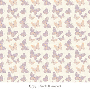 Butterfly Kisses wallpaper in Grey, small 12 in repeat, lavender and peach butterflies on a cream ground