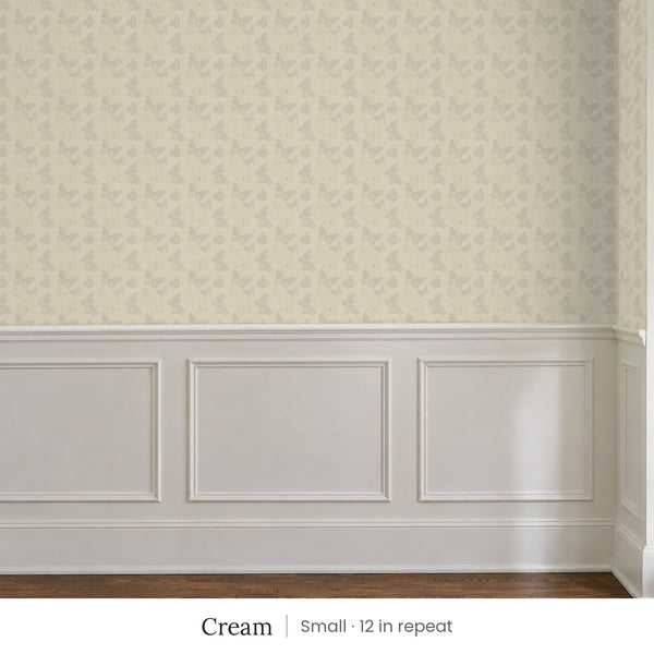 Butterfly Kisses Cream peel and stick wallpaper, small 12 in repeat, above white panel wainscoting