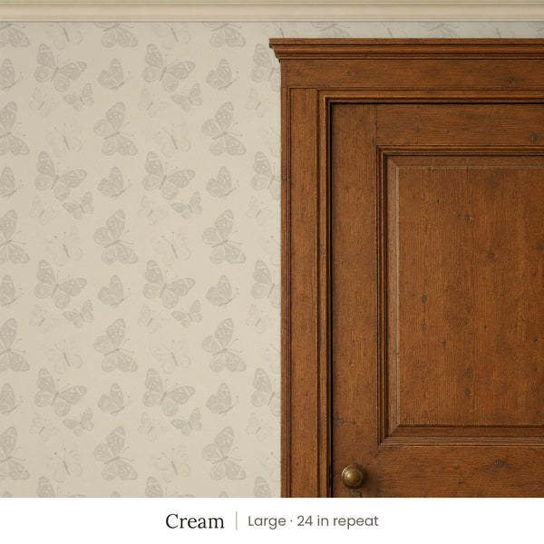 Butterfly Kisses Cream peel and stick wallpaper, large 24 in repeat, beside a wood door