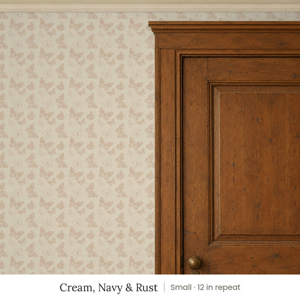 Butterfly Kisses Cream, Navy & Rust peel and stick wallpaper, small 12 in repeat, beside a wood door