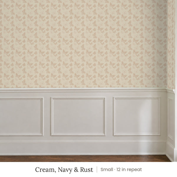 Butterfly Kisses Cream, Navy & Rust peel and stick wallpaper, small 12 in repeat, above white panel wainscoting