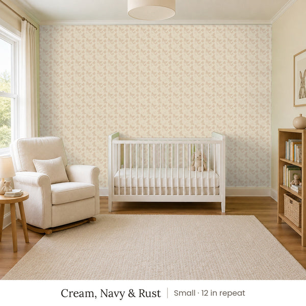 Butterfly Kisses Cream, Navy & Rust peel and stick wallpaper, small 12 in repeat, in a nursery with a white crib and a rocking chair