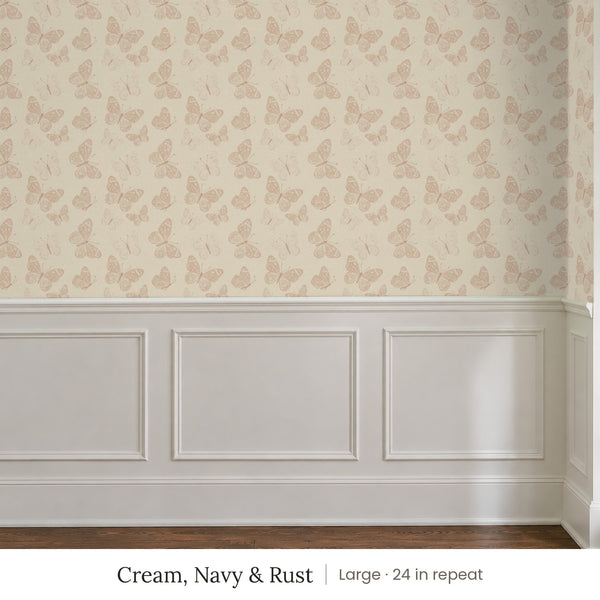 Butterfly Kisses Cream, Navy & Rust peel and stick wallpaper, large 24 in repeat, above white panel wainscoting