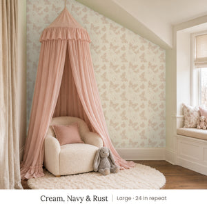 Butterfly Kisses Cream, Navy & Rust peel and stick wallpaper, large 24 in repeat, in a girl's reading nook with a pink canopy and a window seat