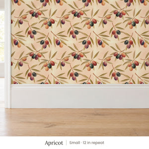 Olivia Apricot peel and stick wallpaper, small 12 in repeat, above a white baseboard and oak floor