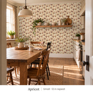 Olivia Apricot peel and stick wallpaper, small 12 in repeat, in a kitchen with a farmhouse table and open shelves