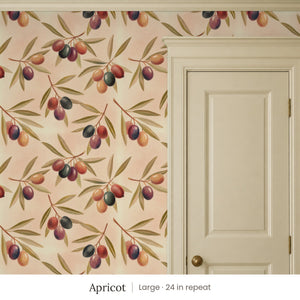 Olivia Apricot peel and stick wallpaper, large 24 in repeat, beside a cream paneled door