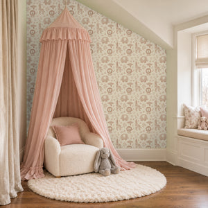 Sloe Blush peel and stick wallpaper in a girl's reading nook with a pink canopy and a window seat