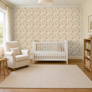Sloe Blush peel and stick wallpaper in a nursery with a white crib and a rocking chair
