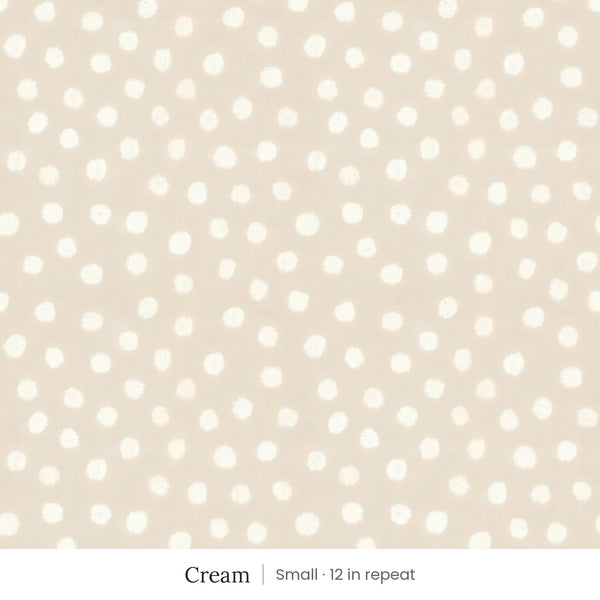 Nellie wallpaper in Cream, small 12 in repeat, soft painted cream dots on a sand ground