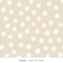 Nellie wallpaper in Cream, large 24 in repeat, soft painted cream dots on a sand ground