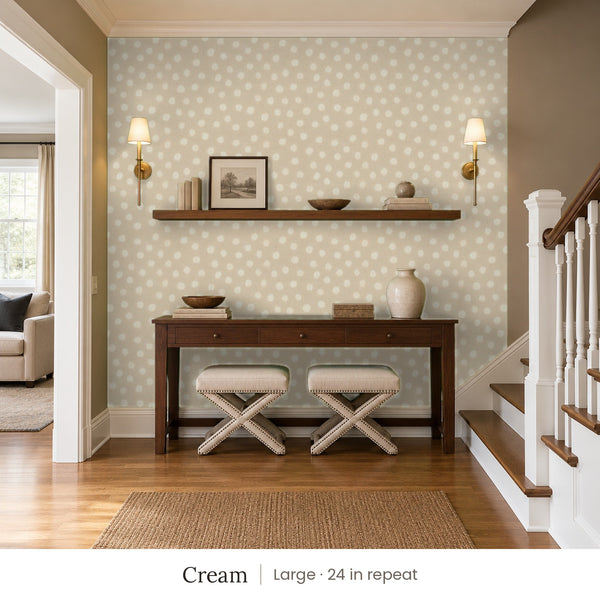 Nellie Cream peel and stick wallpaper, large 24 in repeat, in an entry with a wood console and a staircase