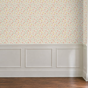Marguerite Cream peel and stick wallpaper above white panel wainscoting