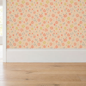 Marguerite Apricot peel and stick wallpaper above a white baseboard and oak floor