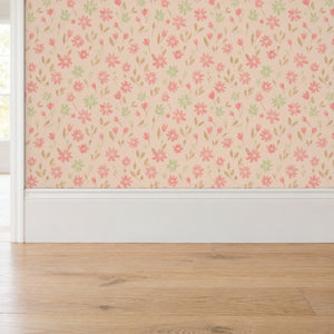 Marguerite Rosebud peel and stick wallpaper above a white baseboard and oak floor