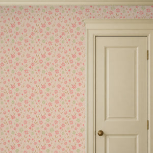Marguerite Rosebud peel and stick wallpaper beside a cream panel door