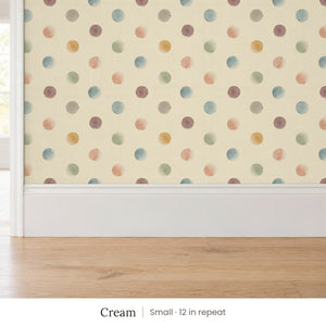 Celia Cream peel and stick wallpaper, small 12 in repeat, above a white baseboard and oak floor