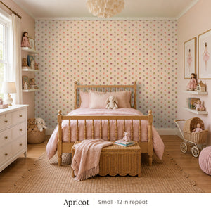 Celia Apricot peel and stick wallpaper, small 12 in repeat, in a girl's bedroom with a spindle bed and a doll stroller