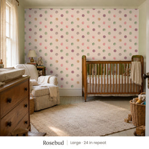 Celia Rosebud peel and stick wallpaper, large 24 in repeat, in a nursery with a wood crib and a dresser