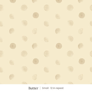Celia wallpaper in Butter, small 12 in repeat, soft tan watercolor dots on a butter yellow ground