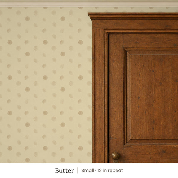 Celia Butter peel and stick wallpaper, small 12 in repeat, beside a dark wood panel door
