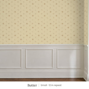 Celia Butter peel and stick wallpaper, small 12 in repeat, above white panel wainscoting