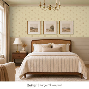Celia Butter peel and stick wallpaper, large 24 in repeat, in a bedroom with shiplap paneling and framed landscape prints