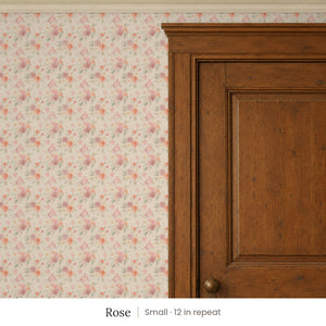 Ashwell Rose peel and stick wallpaper, small 12 in repeat, beside a dark wood panel door