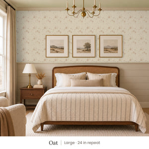 Ashwell Oat peel and stick wallpaper, large 24 in repeat, in a bedroom with shiplap paneling and framed landscape prints