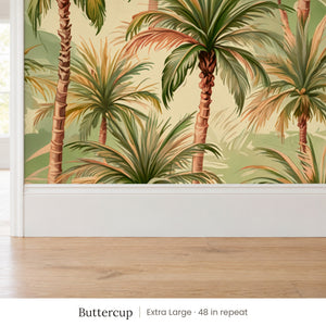 Palm Buttercup peel and stick wallpaper, extra large 48 in repeat, above a white baseboard and oak floor